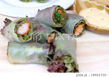 Vegetable salad wrapped into spring rolls  18942720