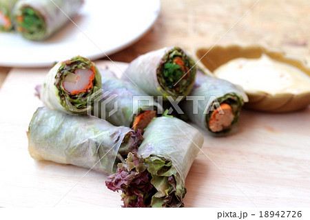 Vegetable salad wrapped into spring rolls Vegetable salad wrapped into spring rolls 18942726