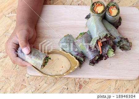 Vegetable salad wrapped into spring rolls Vegetable salad wrapped into spring rolls 18946304