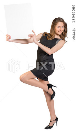 Young girl is holding a big empty billboard 18949066