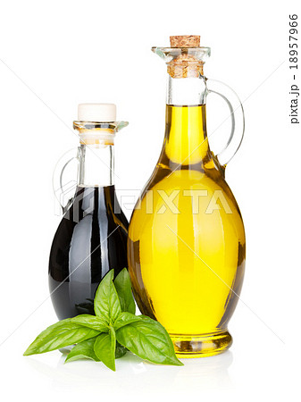 Olive oil and vinegar bottles with basil Olive oil and vinegar bottles with basil 18957966