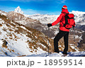 Hiker takes a rest admiring the Matterhorn peak. Hiker takes a rest admiring the Matterhorn peak. 18959514