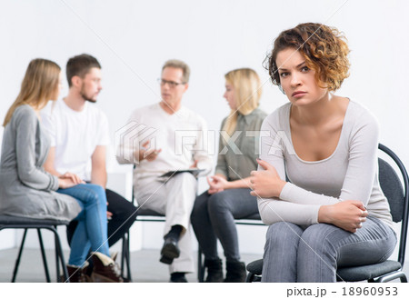 Psychologist working with group of people Psychologist working with group of people 18960953