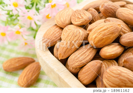 Almond in wooden cup. 18961162
