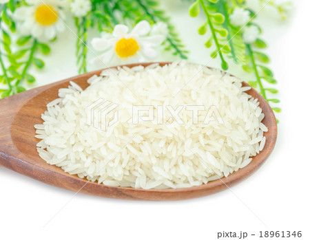 Jasmine rice in wooden spoon. Jasmine rice in wooden spoon. 18961346