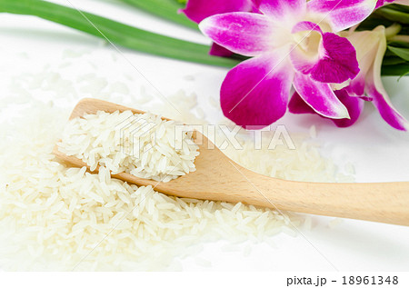 Raw rice with violet orchid flower. Raw rice with violet orchid flower. 18961348