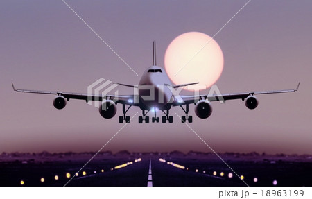 Airplane touch down during sunset 18963199