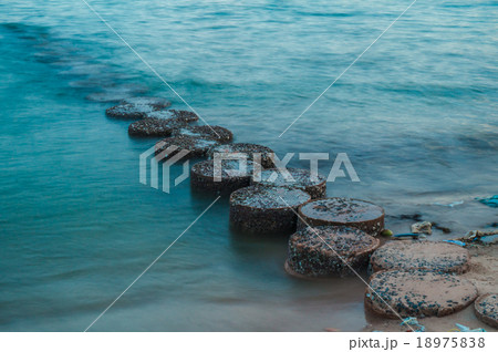row of stones stepping on the sea 18975838