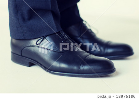close up of man legs in elegant shoes with laces 18976186