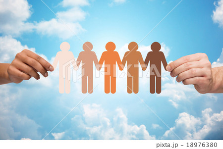 hands holding chain of people pictogram over sky 18976380