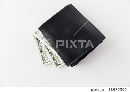 close up of dollar money in black wallet on table close up of dollar money in black wallet on table 18976596