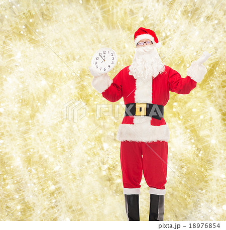man in costume of santa claus with clock man in costume of santa claus with clock 18976854