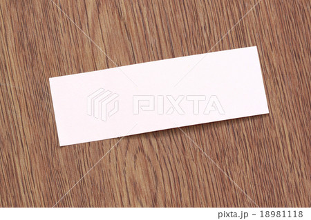 Rectangle of note paper stuck on dark wood. 18981118