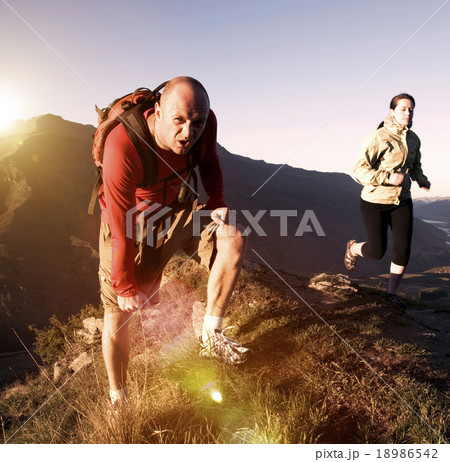 Extreme Athletes Exercising in the Mountains Concept 18986542