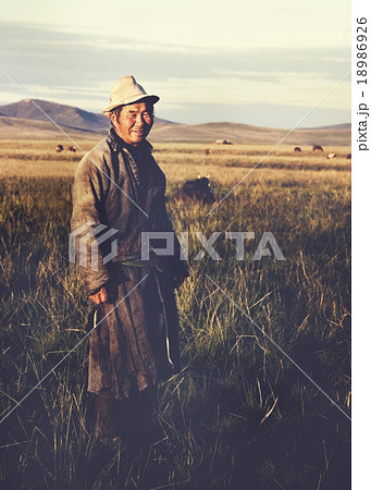 Mongolian Milking Man Standing Scenic View Field Concept Mongolian Milking Man Standing Scenic View Field Concept 18986926