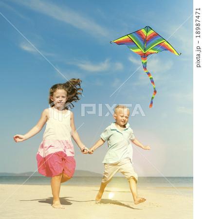 Sister Brother Beach Vacation Summer Playing Kite Concept Sister Brother Beach Vacation Summer Playing Kite Concept 18987471