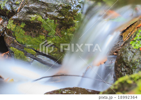 waterfall and rocks covered with moss 18992364