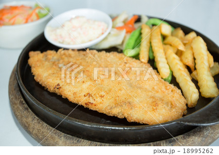 fried breaded fish steak 18995262