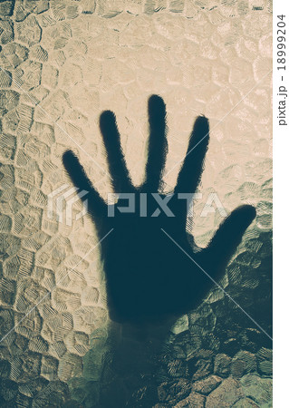 hand behind the glass 18999204