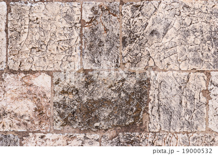 Old wall made of the Jerusalem stone 19000532