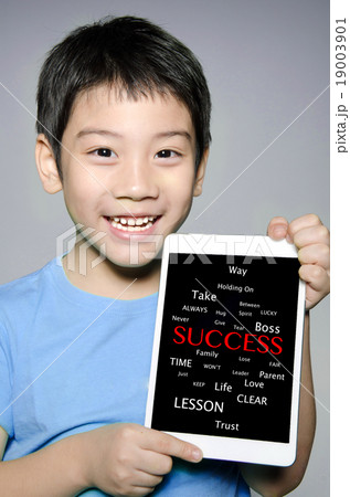 Asian boy holding tablet computer Success concept Asian boy holding tablet computer Success concept 19003901