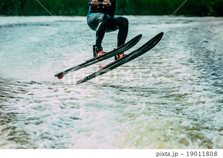 young man riding on water skis 19011808