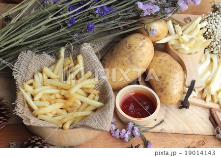 French fries and fresh sliced potatoes  19014143
