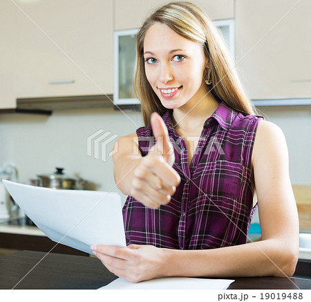 Smiling woman with documents 19019488