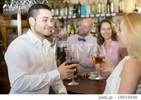 Restaurant visitors drinking wine Restaurant visitors drinking wine 19019886