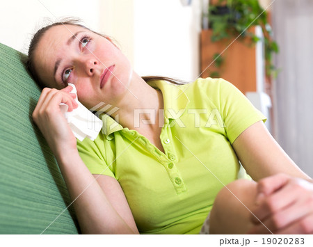 Stressed woman crying and wiping tears Stressed woman crying and wiping tears 19020283