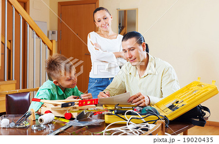 Man with son doing something with working tools Man with son doing something with working tools 19020435