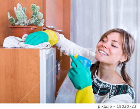Young woman doing clean-up Young woman doing clean-up 19020723