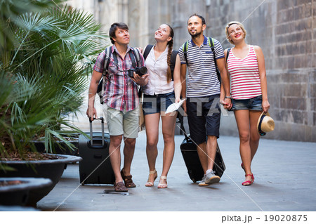 Tourists at vacation walking the street Tourists at vacation walking the street 19020875