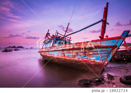 Large fishing boats beached at low tide. Large fishing boats beached at low tide. 19022714