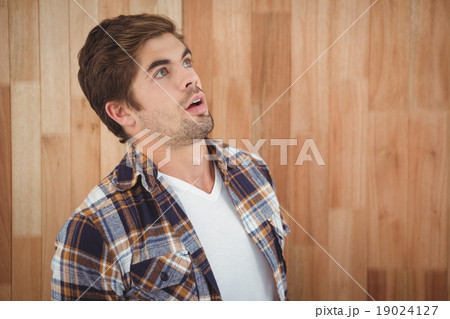 Surprised hipster looking up Surprised hipster looking up 19024127