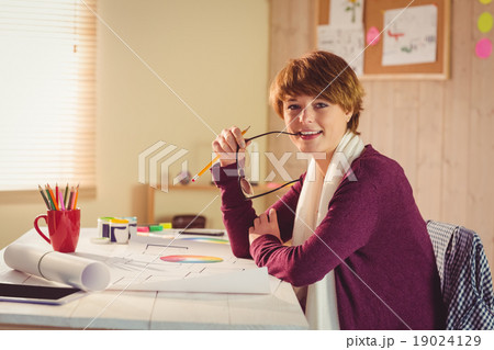 Graphic designer working at desk Graphic designer working at desk 19024129
