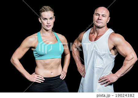 Portrait of confident athlete man and woman with hands on hip Portrait of confident athlete man and woman with hands on hip 19024382