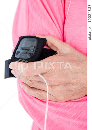 Woman holding mp3 player on armband 19024388