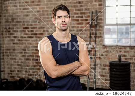 Serious man with arms crossed 19024545
