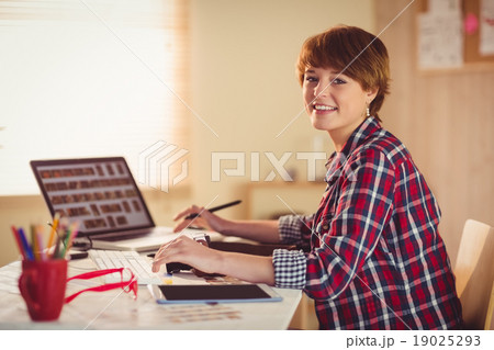 Smiling photographer looking at camera 19025293