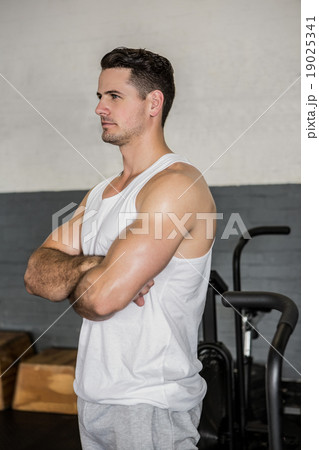 Handsome man posing with arms crossed Handsome man posing with arms crossed 19025341