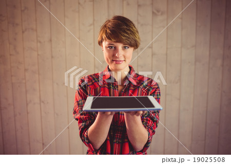 Pretty young woman holding tablet 19025508
