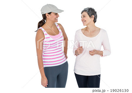 Happy fit women discussing 19026130