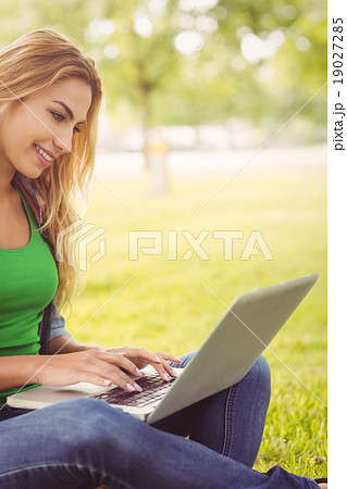 Happy woman using laptop Happy woman using laptop 19027285