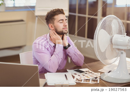 Relax businessman with eyes closed Relax businessman with eyes closed 19027563