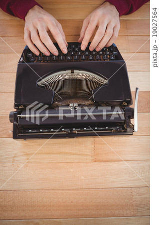 High angle view of man using typewriter High angle view of man using typewriter 19027564