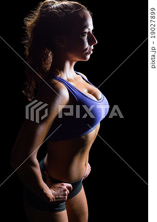 Side view of sexy athlete with hands on hip Side view of sexy athlete with hands on hip 19027899