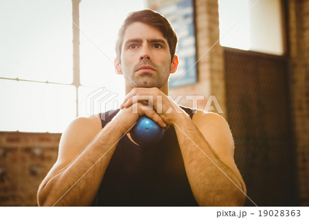 Man holding medicine ball Man holding medicine ball 19028363