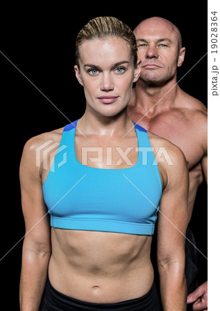 Portrait of muscular woman and man Portrait of muscular woman and man 19028364