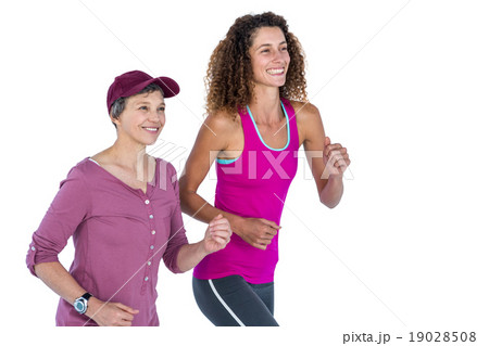 Cheerful female friends jogging Cheerful female friends jogging 19028508